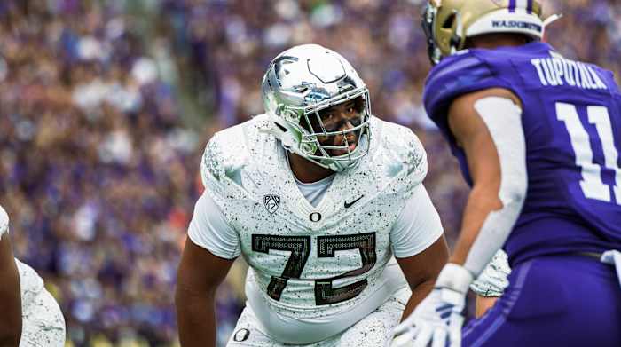 Oregon Ducks offensive lineman Iapani Laloulu ahead of a snap against the Washington Huskies.